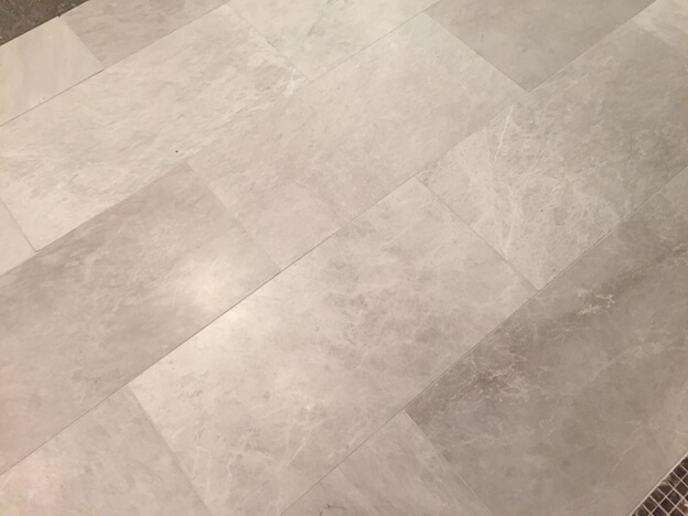 Etched stone tile flooring