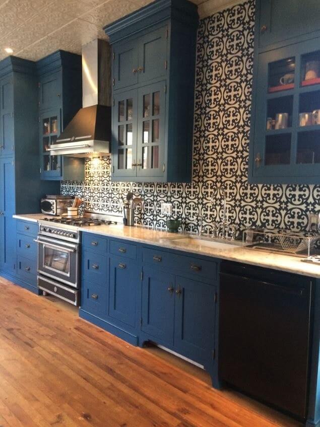 Cement tiles on a kitchen backsplash create a stunning contrast